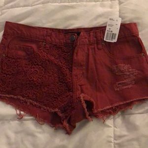 Red cut off shorts